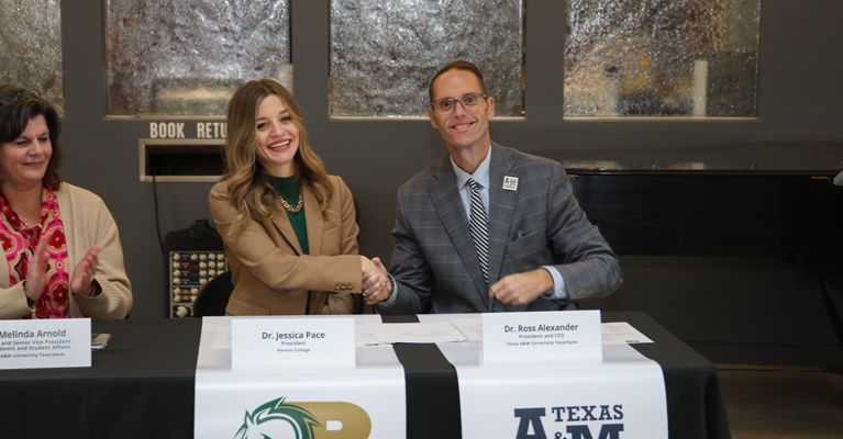 Dr. Jessica Pace (left), President of Panola College and A&M-Texarkana President Dr. Ross Alexander sign an agreement forming a partnership between the two institutions. The partnership creates specific pathways for Panola College graduates to earn a bachelor’s degree at A&M-Texarkana, provides greater scholarships for Panola College transfer students, and allows Panola College employees to take coursework at A&M-Texarkana with discounted tuition rates.