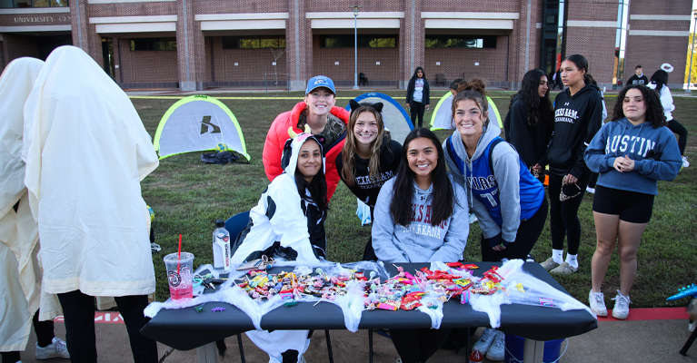 Members of the TAMUT women’s soccer team participate in the 2023 Trunk-n-Treat on the TAMUT campus. Children took turns kicking a soccer ball into a small goal to win prizes!