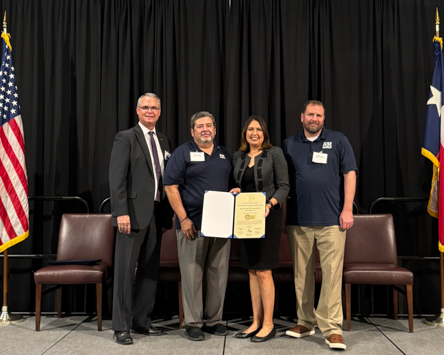 Charles Catoe, Program Operations Director for the Texas Veterans Commission, Robert Hernandez, Manager of TAMUT’s Veterans Services Center, Laura Koerner, Commission Chair for the Texas Veterans Commission, and David Rodeheaver, TAMUT Veteran Admissions Coordinator pose for a recent photograph in College Station where the A&M-Texarkana Veterans Services Center received the Gold Veterans Education Excellence Recognition Award.