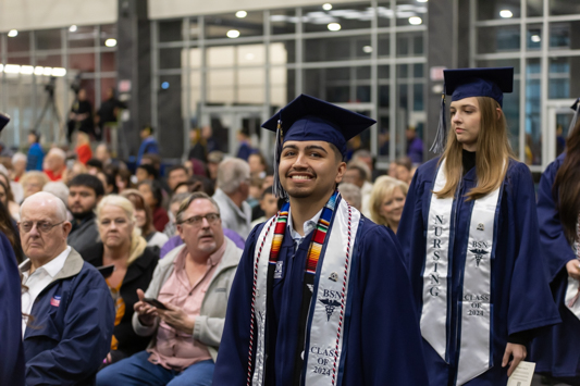 Graduates file into the commencement ceremony in front of family and friends on Saturday, December 14, 2024. The ceremony took place inside the Lois and Cary Patterson Student Center on the A&M-Texarkana campus.