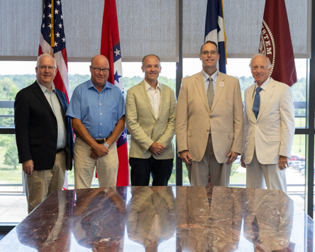 Representatives from Offenhauser & Co. stand with Texas A&M University-Texarkana President Dr. Ross Alexander after signing a memorandum of understanding forming a partnership between the company and the University. Pictured in the photo are (from left) Don Morriss, Derick Giles, Collins Bruner, Dr. Ross Alexander, and Scott Bruner.