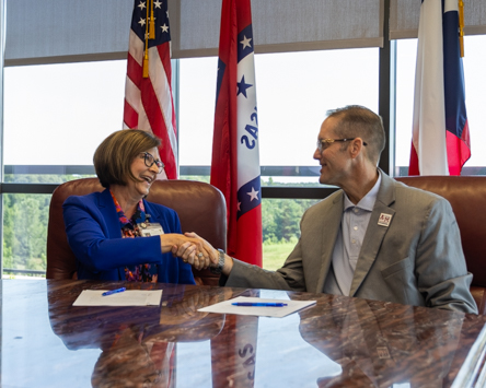 Genesis PrimeCare CEO Carla Roadcap and Texas A&M University-Texarkana President Dr. Ross Alexander sign a memorandum of understanding forming a partnership between the university and the healthcare provider. The partnership allows full-time Genesis PrimeCare employees to receive discounted tuition on courses at the university.