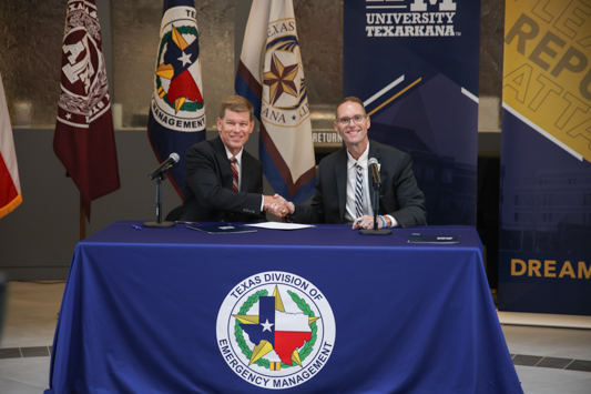 TDEM Chief Nim Kidd (left) and TAMUT President Dr. Ross Alexander shake hands after formally launching a new partnership between the Texas Division of Emergency Management and Texas A&M University-Texarkana.